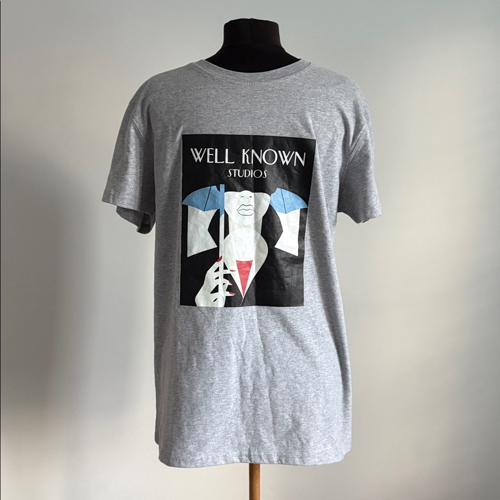 Well Known Studios woman with umbrella shirt medium